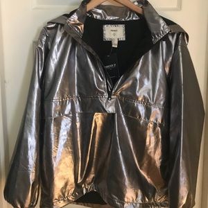 Silver half zip hooded style jacket.